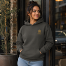 Woman wearing vintage black King Eddie Heritage Hoodie with gold crest logo outside a café